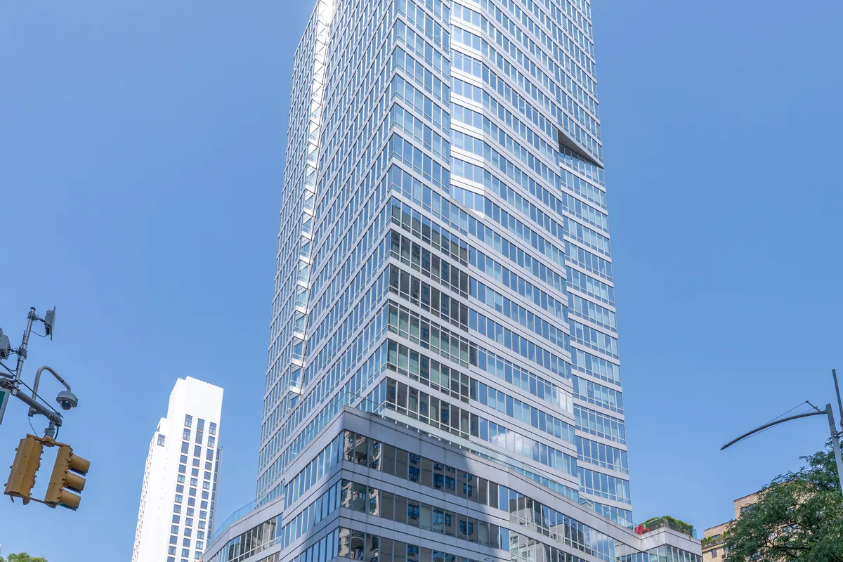Casa 74, a glass condominium tower at 255 East 74th Street and Second Avenue on Manhattan's Upper East Side, viewed from across Second Avenue