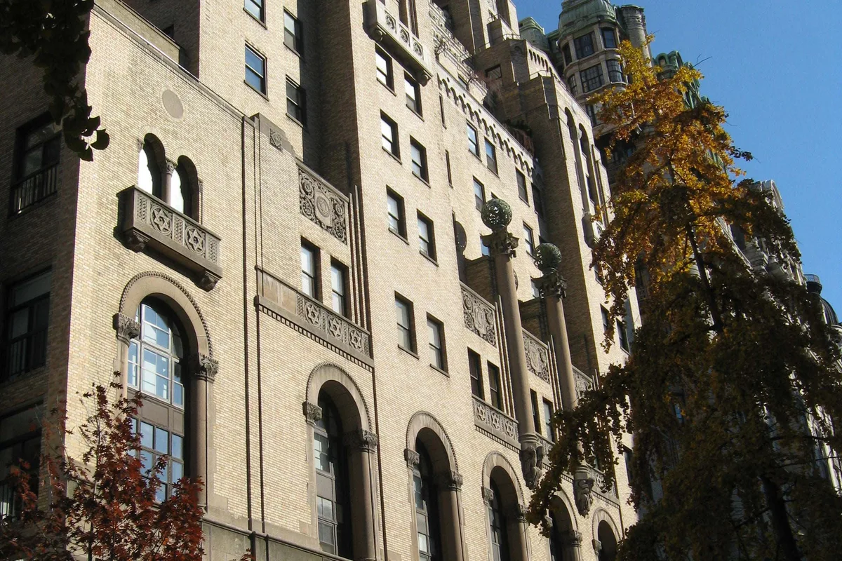 Arched windows, carved stone balconies, and globe-topped columns on the West 73rd Street facade of the Level Club
